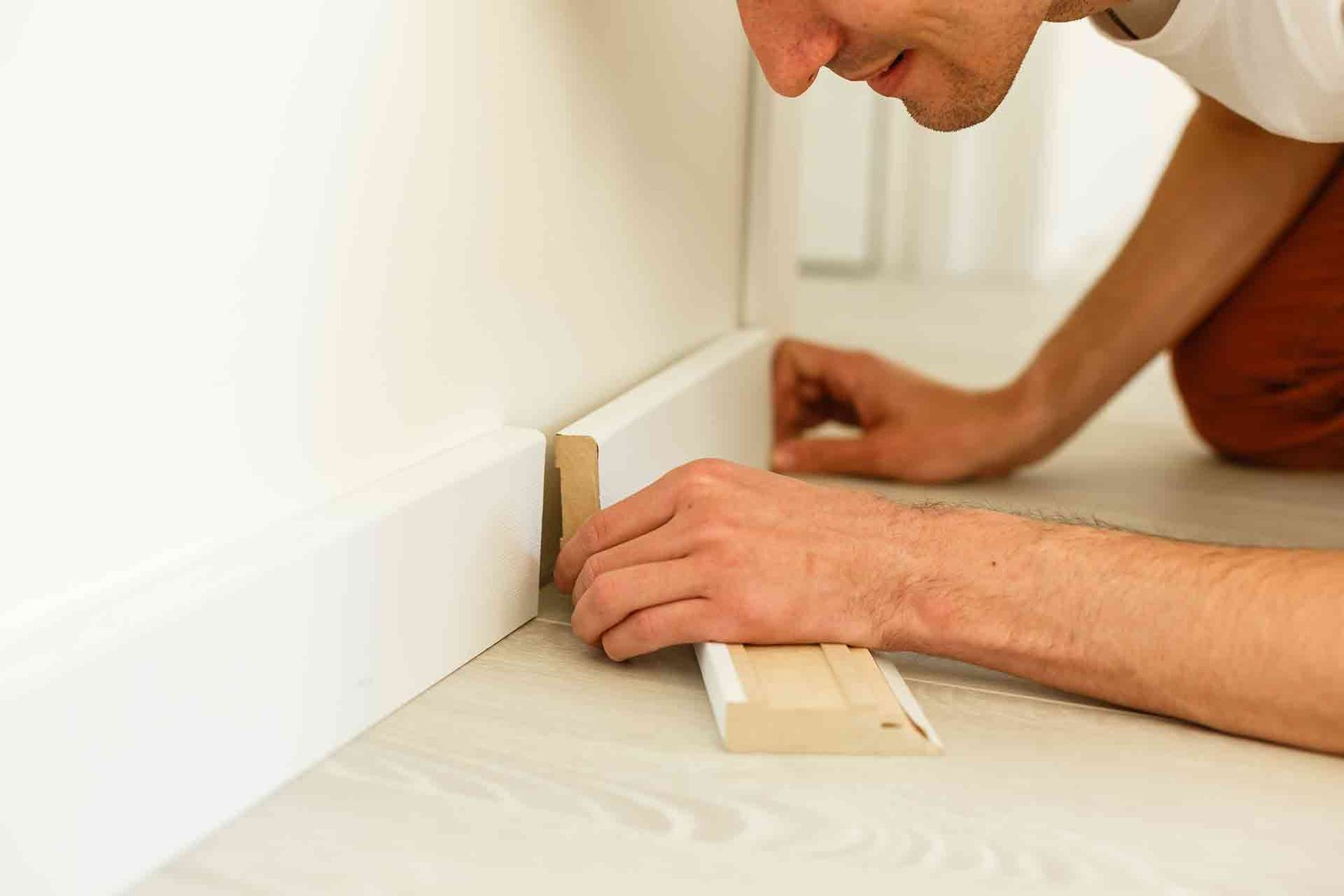 Skirting board fitting